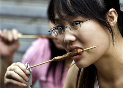 eating food - this is a picture of a woman eating the food she likes.