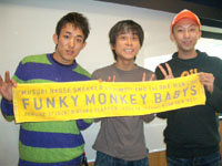 Funky Monkey Babys - Funky Monkey Babys members, holding a banner with their band name. x3