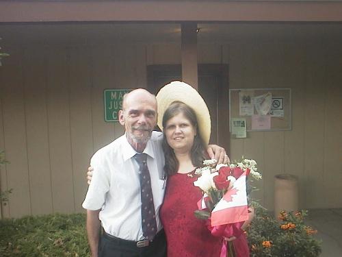 My Husband And I On Our Wedding Day, September 6,  - Here we are!!! I always said I was going to wear red on my wedding day. We got married in a small infomal cerimony in Arizona, and we will 'get married again' in a larger, more formal cerimony with my family in Canada.