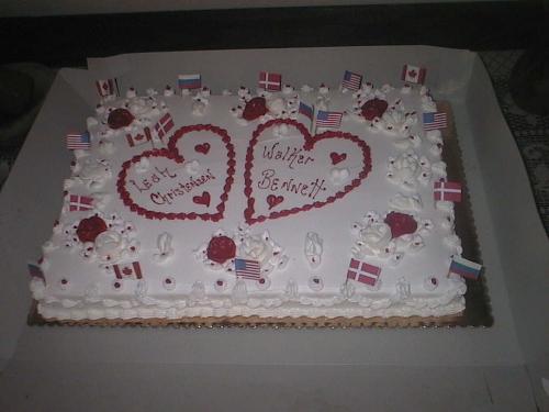Our Wedding Cake - We had our wedding reception tonight, after getting married by a Judtice of the Peace on Thursday. We are still in Arizona right now, but we plan to have a larger reception and re-do our wedding in Canada where my family lives. Notice the flags? Danish, Canadian, American and Russian.