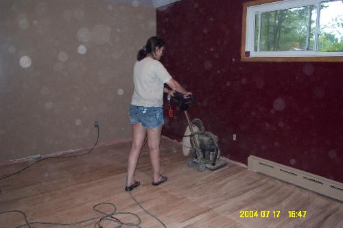 Refinishing the floor - Here you can see the machine she rented to do the floor.