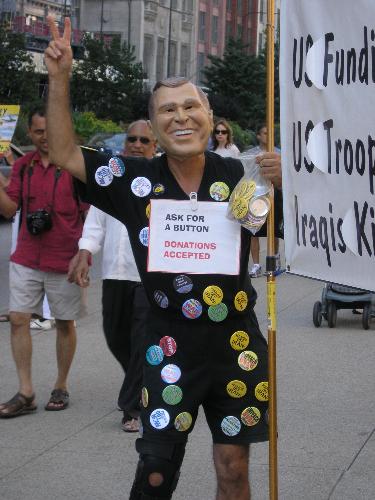 Protesters Against Bush - I was downtown Chicago last week and there were a few protesters. This was one of the guys and he gave me a few buttons.