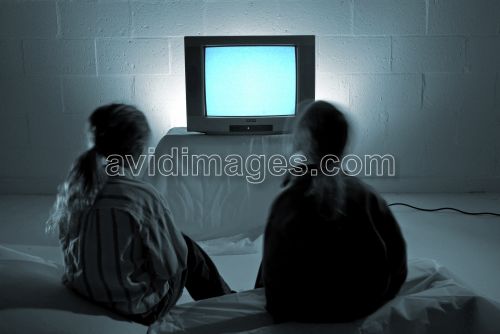 Watching television - Two kids watching TV
