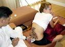 Angelina Jolie -  Angelina Jolie getting tattooed in thai on her visit