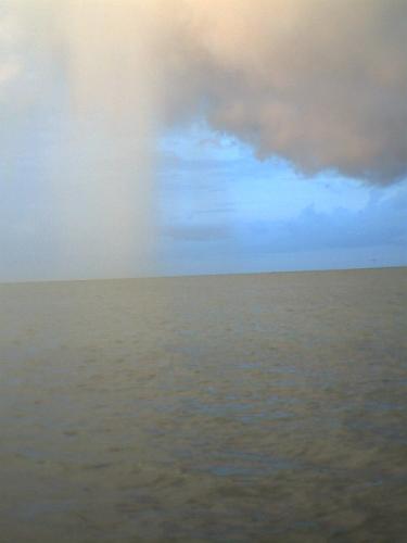 Selective pouring - This pic was taken early in the morning in Port Aransas, Texas. The weather forcast was pretty gloomy with Hurricane Humberto just a little way up the coast. We were out on a fishing boat and got close enough to snap this pic of a very dark stormcloud hanging very low in the sky. As our boat drifted just a little, I was able to catch the cloud next to it pouring like a waterfall. Selective pouring - This pic was taken early in the morning in Port Aransas, Texas. The weather forcast was pretty gloomy with Hurricane Humberto just a little way up the coast. We were out on a fishing boat and got close enough to snap this pic of a very dark stormcloud hanging very low in the sky. As our boat drifted just a little, I was able to catch the cloud next to it pouring like a waterfall.