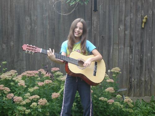 Playing Guitar - Lauren, serenading me on the Guitar... her newest interest. Playing Guitar - Lauren, serenading me on the Guitar... her newest interest.