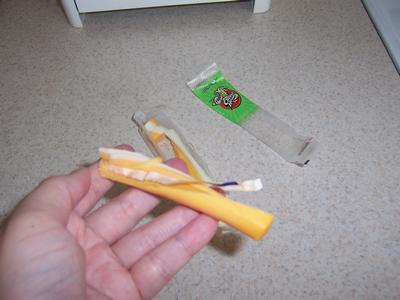 cheese with plastic stuck in it - This was the cheese stick that had plastic in the middle.