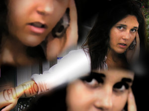 On the phone - Girl was on her cellphone and oddly enough decided to make that the focus of the image. Edited in Photoshop.