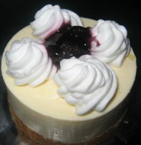 Blueberry cheesecake with whipped cream - blueberry cheesecake topped off with dollops with whipped cream..yummy