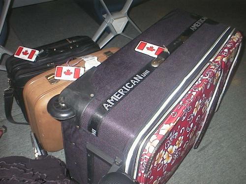Mis-matched Luggage - Here is my various assortment of luggage, a laptop case, a tiny ugly brown suitcase, and a brand new nice one. They're all very different, but they all serve a wonderful purpose and get my things where they need to go, safely.