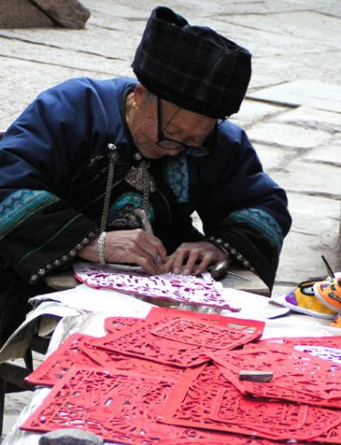 an old tujia man - local craftsman.
