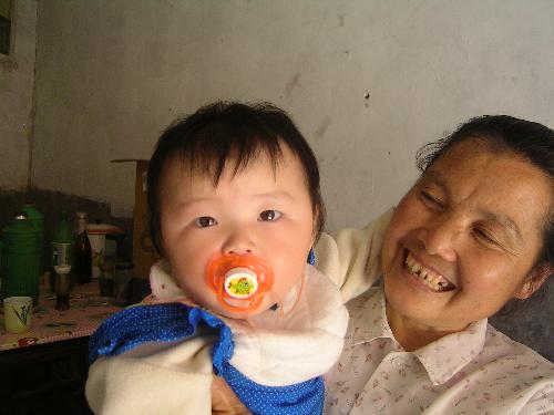 My daughter and My mother in law - This is a group photo of my daughter and my mother in law. It was taken when my girl was eight months old. She is over one year old now. She is able to call me mum when she was nine months old. *^_^*