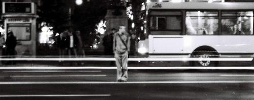 Crossing - Night shot of a guy across the street.