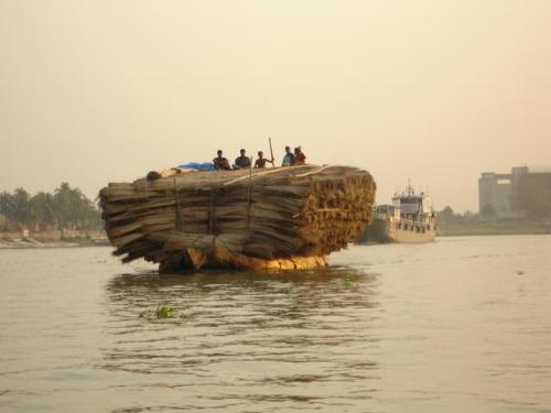 River in Bangladesh - Boat carrying goods in the river