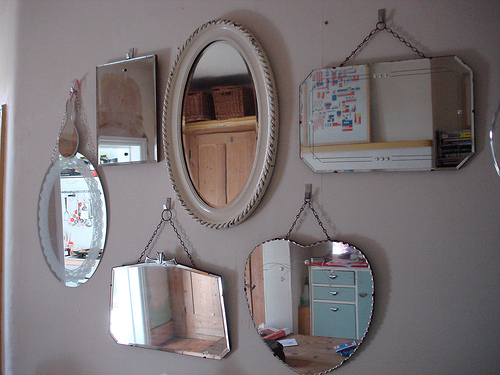 Mirrors - a bunch of mirrors hanging on a wall