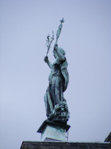 statue on top of the Palace in Amsterdam - statue on top of the Palace in Amsterdam on the Dam