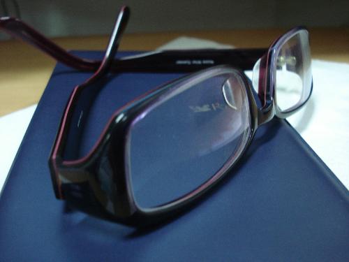 eyeglasses - Taking the time to take off the eyeglasses after a hard days work. It's important to rest your eyes from staring at the PC monitor for a very long time.