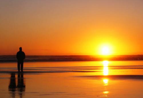 1 person & 2 Shadows - A picture of one guy standing at the beach with 2 shadows behind him! 

Really good pic!