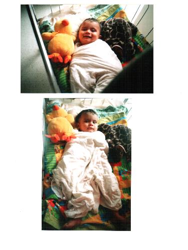 Omkar in crib - This is 8 month old Omkar soon after a bath