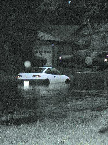 Car in flood - This is a car that was floating down the road.