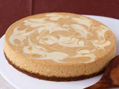 Pumpkin Swirl Cheesecake - A Pumpkin Swirl Cheescecake with a ginger biscuit and pecan base. Yumm!