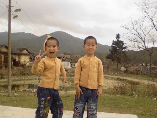 My Twin Nephews in my hometown - The old house is the one we used to live in, but everybody moves out and live in some new houses now.
