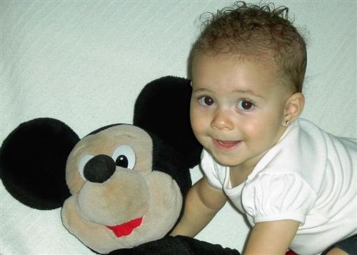 Isabelle and Mickey - Isabell at about 8 1/2 months posing with her moms Mickey Mouse doll.