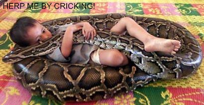 Snakes - poor boy with his pet snake wrapped around him