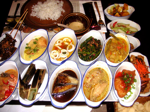 Indonesian Rice Table - A variety of curries, rice, noodles and vegetables make up an Inonesian Rice Table.