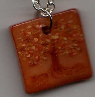 Autumn Tree Pendant - Pendant made of polymer clay, stained a rich terracotta color and handpainted. The pendant is then coated with a generous coat of gloss glaze finish and comes with a silver chain necklace. This item can be found at my etsy shop. My shop name is the same as my user name here!  Let me know what you think!!