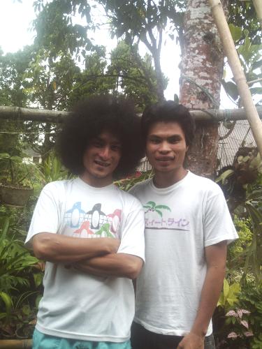 My sib and Me - The picture was taken in my home. It was me and my curly brother. He is one year younger than me. For exactly one and a half year. Rather than look like brothers, we are like friends. Many people are to be wrong when they judge us. Some say that we are not brother. Some say that we are friend. Some others say that we are cousin. I know the reason, because both of us have clear differences.   My Dad says that his curly hair comes from his mother side. I can see it from my uncle and aunt, my Dad's sibs.   When the first time he appear like that to public. People were amazed. Some say that it was imitation, it wasn't real. Some tried to prove it by touching.   This is real story, when he for the first time went to church with that hair. People in the church did not have anymore attention to the altar or tho the priest, but to him. Even when the offering time, people were so crazy talking about him instead of singing.   Even today, when he visit a new place in my province people are still amazed with him. It is weird to us to have curly hair like he does.