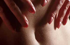Pleasuring Oneself. - a female torso, hands heading down below. ;)
