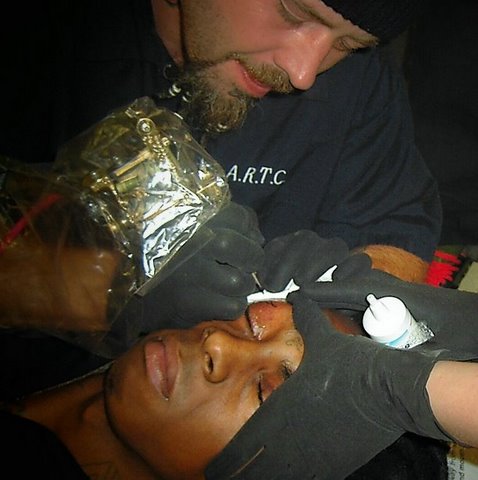 tattooing rapper Lil Waynes eyelids - Lil Wayne getting Fear God tattooed on his eyelids by me