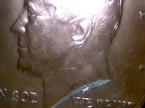 Kennedy Half Dollar Detail - Detail of a Kennedy half dollar with the so-called hammer and sickle.