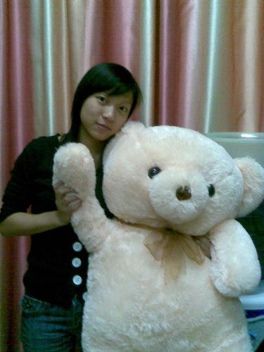 A girl - the lovely little bear is my birthday present given by my bf.i like it very much.