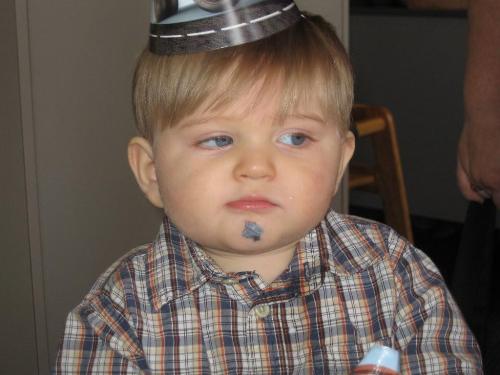 My son - This is my one year old at Chuck E Cheese for his big brothers bday party. He was annoyed to say the least. He is quite the little attention hog!