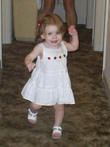 Her first Forth - This is my baby girl at her grandma's house on the Forth of July. She is so cute running to her mommy