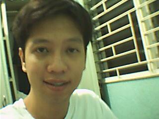 at my room : ) - taken at nighttime. few days before i had a crazy haircut. :0