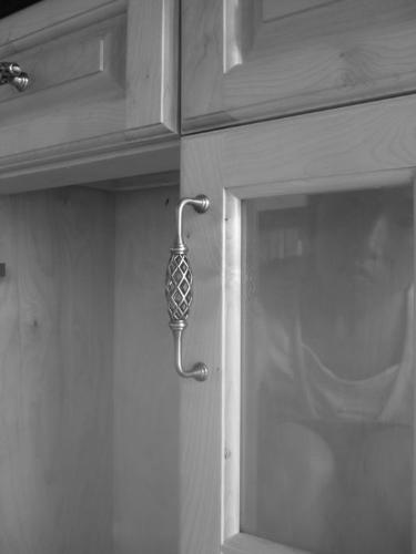 Handle - I took this picture by myself in our showroom, a set of kitchen cabinet which was made of Canadian maple. Handle's pronunciation is similar to hand by hand in Chinese, what I want to express is I am looking for a person could spend my rest of life. Hand by hand!