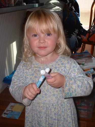 Megan playing her violin - I wanted to share this. What imagination little girls have. These markers were her violin.
