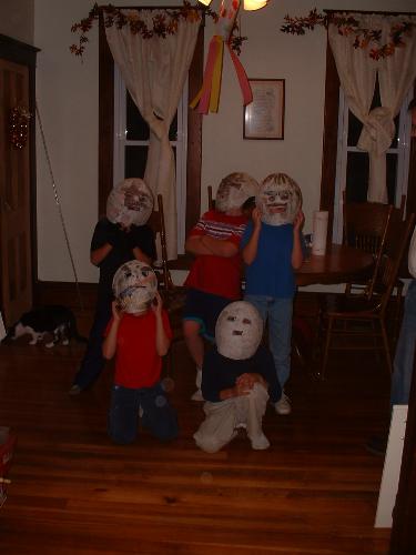 Boyscouts in their masks - Here's most of the boys wearing their paper mache masks.