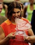 rafa nadal bites his trophy - cute and hottie rafael nadal bites his trophy after the game...