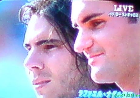 rafael nadal with federrer - pictures are taken after the game at roland garros.