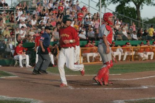 Scoring a run - Madison Mallards player scoring a run during 'Simpsons Night' in Northwoods League action