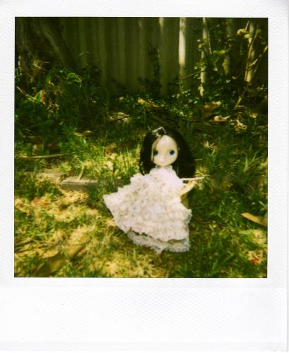 blythe in polaroids - this is a blythe doll in a polaroid photo. I'm interested in blythe and photography.
