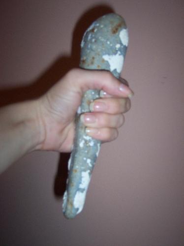 Ancient Tool? (In Hand) - This is a picture of the rock I found that I believe may be an ancient tool, in my hand, to show how it fits in a person's hand and to give perspecitve to it's size.