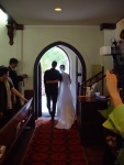 just married! -  a couple leaving the church hand in hand after the marriage ceremony