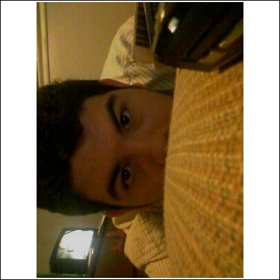 me...half of me...ooh, mysterious. - me in the photo - dxfanatic69 - hiding behind a chair, where my laptop is, while I sit on the floor typing away