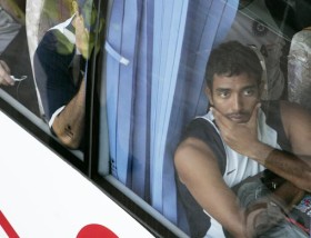 uthappa - uthappa sitting in a bus