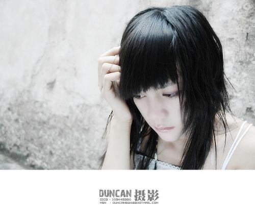 girl with gloomy showing in her eyes - I like the picture, I love the girl. when I learn photography, my teacher tought me that simple background will make your photo looks great. from the photo, I know he is right.